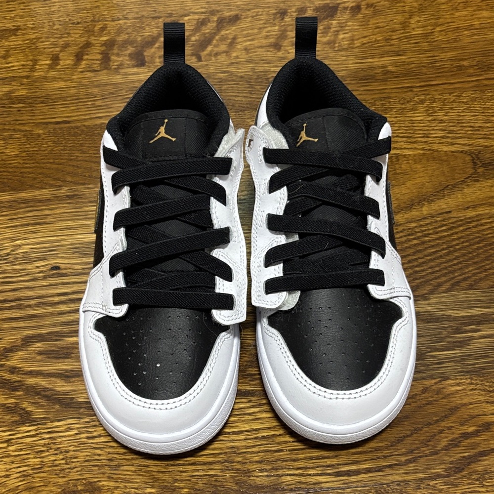 Jordan Kids Black and White Sneakers with Gold Accents